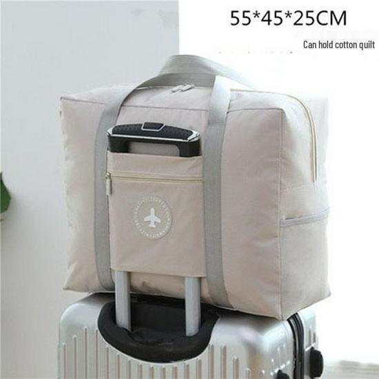 Compact travel bag: suitcase-compatible, hand-held, features an external pocket, handle slip-over design, with matching accessory bag.