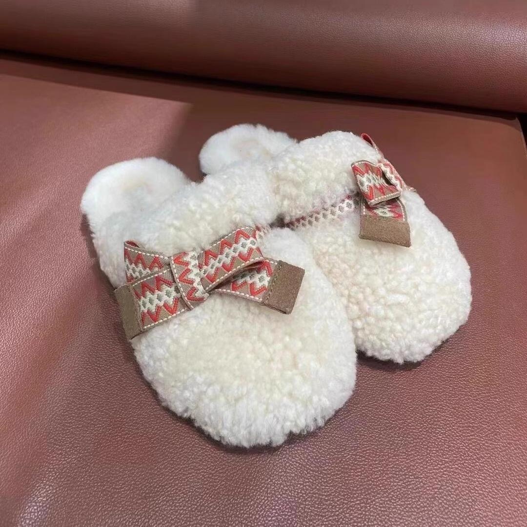 

Гу Юньшу Этнический стиль сумка голова пушистые тапочки женские новые теплые и плюшевые на плоской подошве полутапочки осень-зима 2024 35