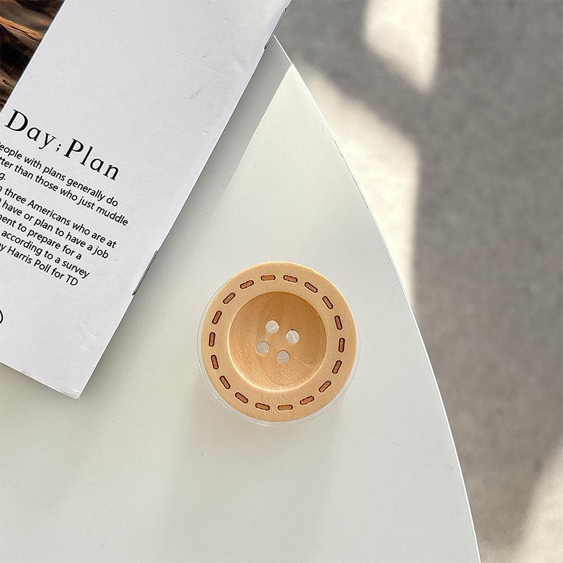 

Korean Wooden Phone Holder: Airbag Button Ring for Desktop Use, Ideal for Hands-Free Viewing