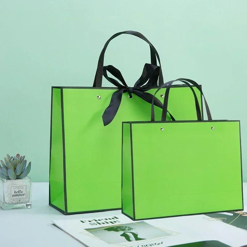 White Paper Jam Handbag Kraft Paper Thick Waterproof Frame Rivet Handle Gift Bag Cosmetic Clothing Store Portable Packaging Bags