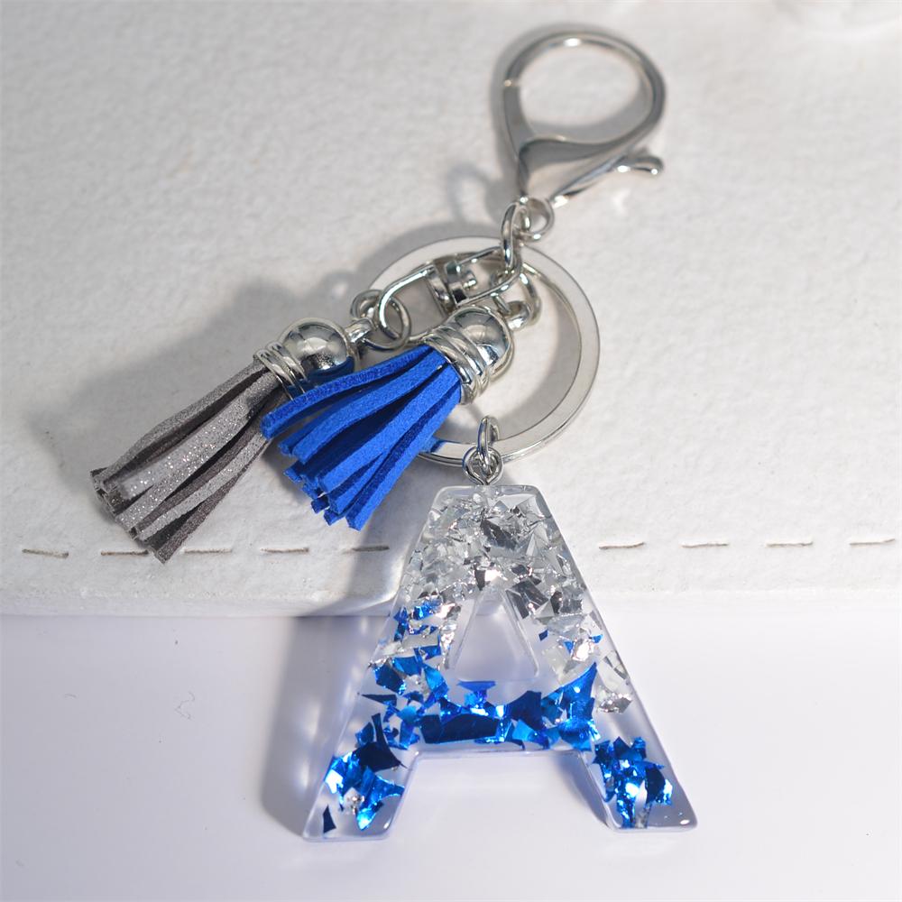 Креативные брелки из смолы с 26 буквами и кисточками — фото 8