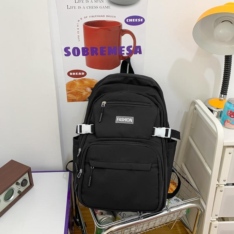 Schoolbag wholesale Korean version of casual large-capacity backpack, junior high school student schoolbag, solid color multi-layer Harajuku backpack