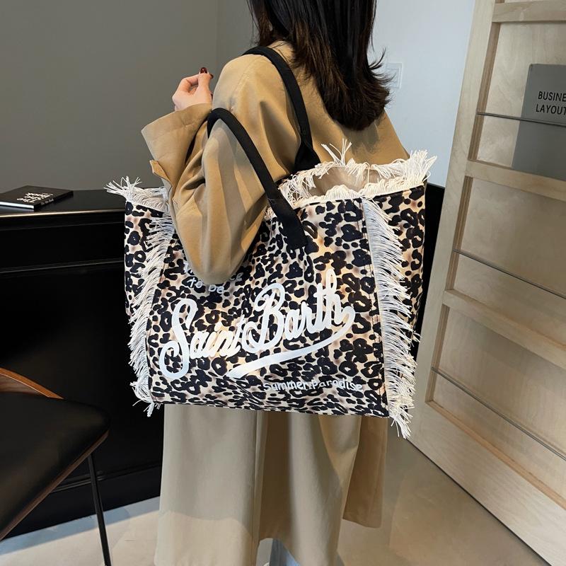 New women's large-capacity leisure travel leopard print canvas handmade fringed handbag tote bag