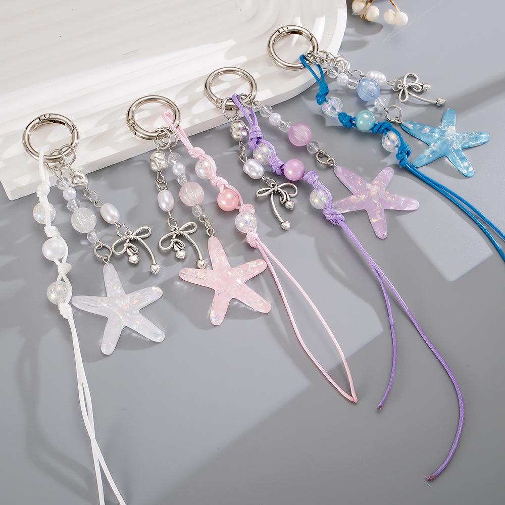 Handmade beaded woven rope pendant with colorful sequins and star-shaped design for mobile phone decoration.