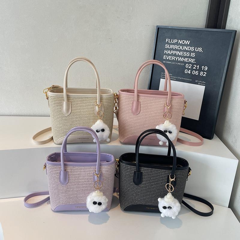 Handwoven straw bag women's new versatile portable bucket bag beach bag shoulder messenger bag