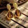 Vintage Amber Water Drop Earrings for Women - Retro Hong Kong Style, Elegant Studs, Light Luxury Fashion.