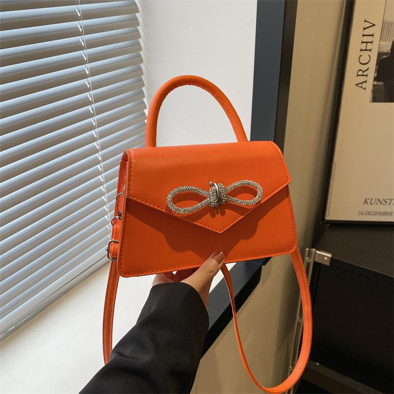 Simple and popular versatile solid color bow sewing line women's bag fashionable oblique span shoulder handbag