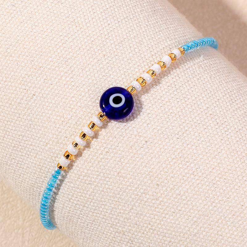 Bracelet en perles d'œil du diable tissé à la main avec motif de niche en verre