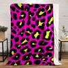 Bold leopard print with black spots, yellow centers, on a pink background. for all seasons blanket lunch break throw gift