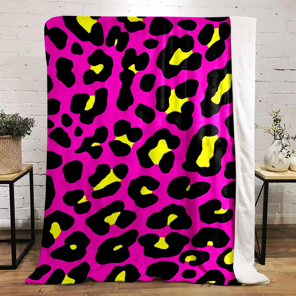 Bold leopard print with black spots, yellow centers, on a pink background. for all seasons blanket lunch break throw gift