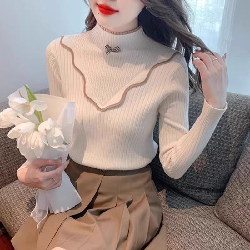 Женский приталенный свитер с оборками и высоким воротником L