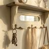 Charming wooden aged white coat rack with three hooks and a mirror