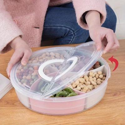 Runder Lebensmittelbehälter mit mehreren Fächern, transparentem Deckel und praktischem Griff - Ideal zur Organisation von Snacks