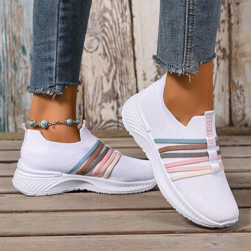 The Lady Wears Slip-On Casual Sports Shoes, Featuring a Breathable Mesh Design with Pastel Stripes, Suitable for Tennis And Comfortable
