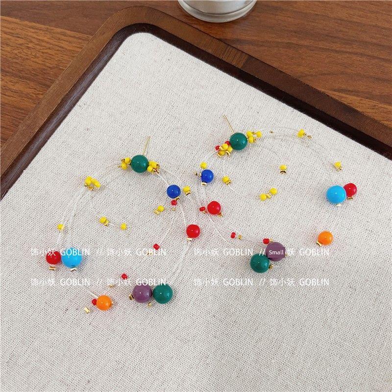 

Летний цвет Великолепные серьги-фейерверки для женщин Нишевая личность Уникальные преувеличенные серьги Дофаминовые длинные серьги-капли Пусеты Fireworks Beaded Earrings