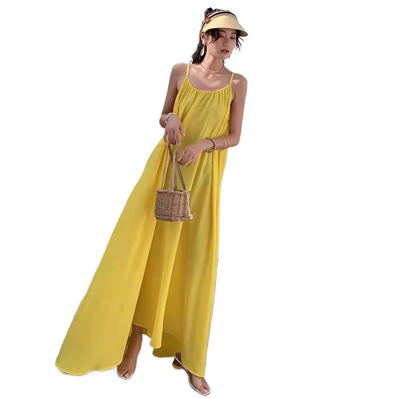 Seaside Vacation Sexy Backless Suspender Dress Women's Summer New Loose A-word Skirt Gentle Yellow Long Skirt