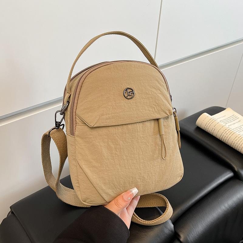 New nylon cloth mini mobile phone bag, female trendy small bag, light portable, simple and fashionable shoulder messenger bag.