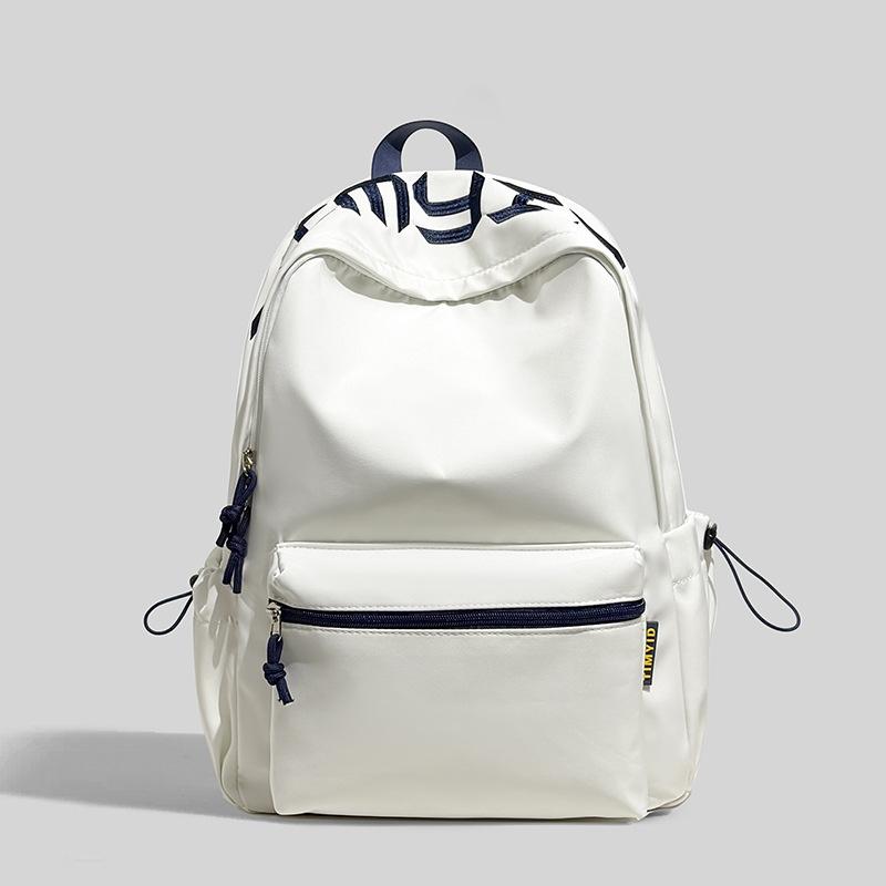 Schoolbag Japanese simple and versatile large-capacity solid color campus schoolbag 1011 summer new light commuter student backpack