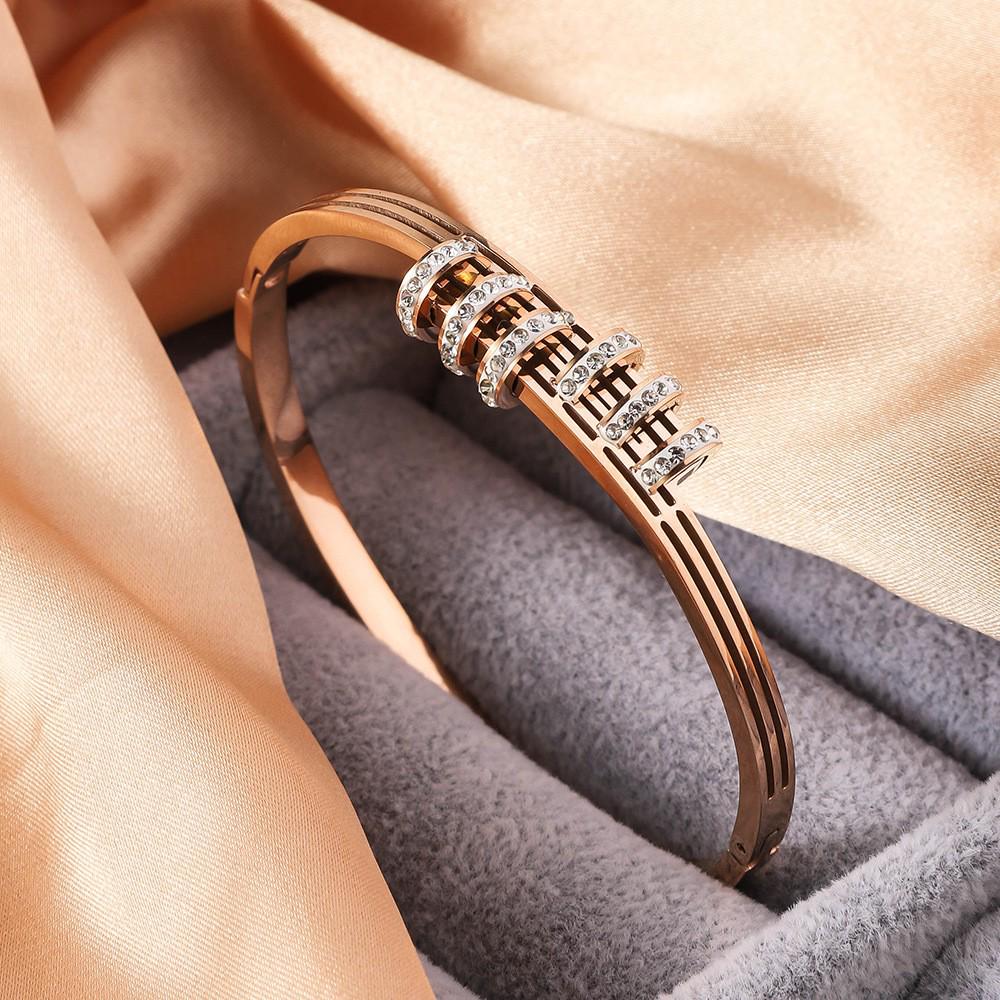 Women's Titanium Steel Luxury Bracelet with Hollow Design and Inlaid Round Diamonds