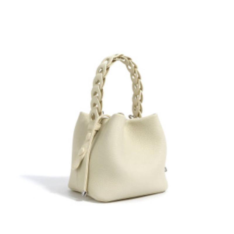Tato jarní kolekce koženého bucket bagu z lícové kůže je všestranná a elegantní taška přes rameno crossbody pro dojíždění.