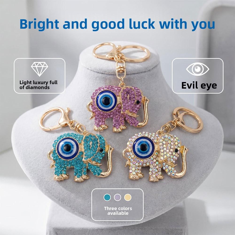 Neuer Schmuck mit blauen Augen - Diamantbesetzter metallisch farbener Elefanten-Schlüsselanhänger, Dämonenaugen-Anhänger