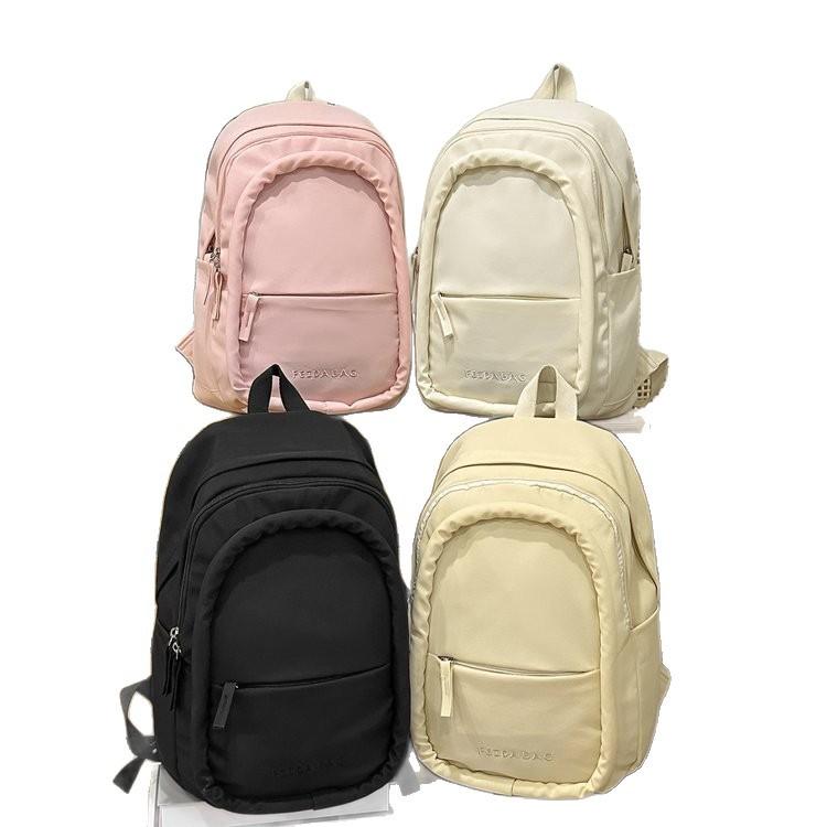 Schoolbag junior high school girls lightweight and simple spine protection to reduce the burden of versatile large-capacity schoolbag out of high
