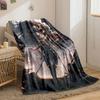 A figure with swords stands in ruins, with a large monstrous figure behind. for all seasons blanket lunch break throw gift