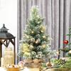 Artificial Christmas Tree 60cm, Mini Flocked Tabletop Christmas Tree with 35 LEDs, Pine Cones, Battery Operated, Green
