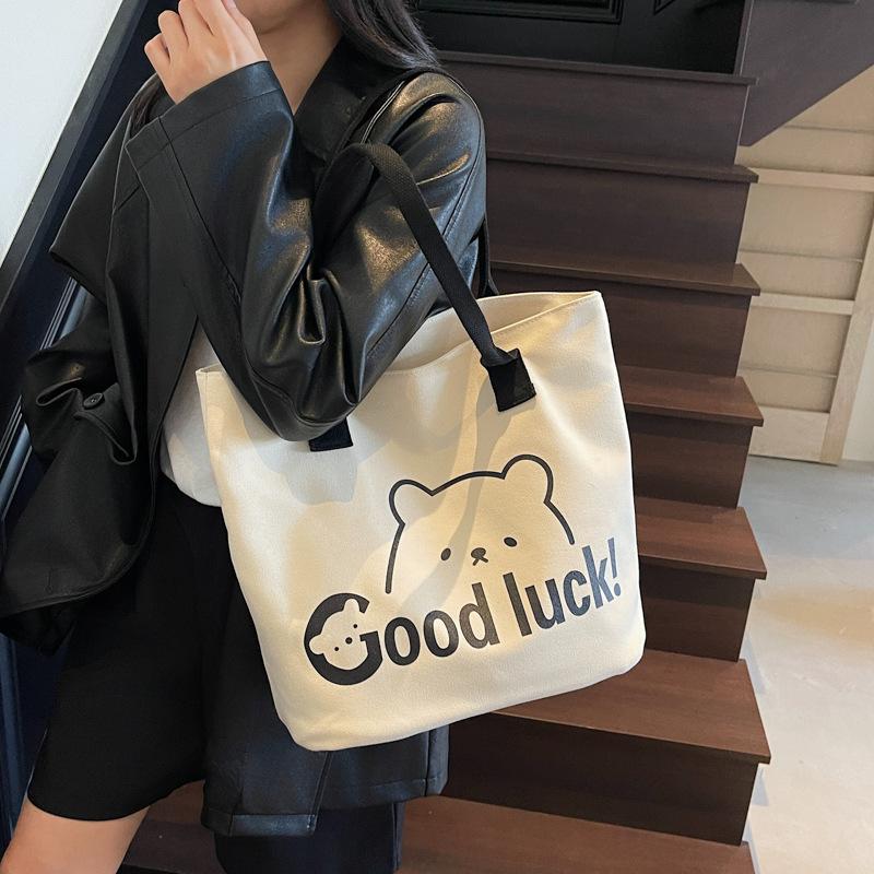 Japanese canvas bag women's shoulder bag 2025 summer new literary style large-capacity simple portable printed canvas bag