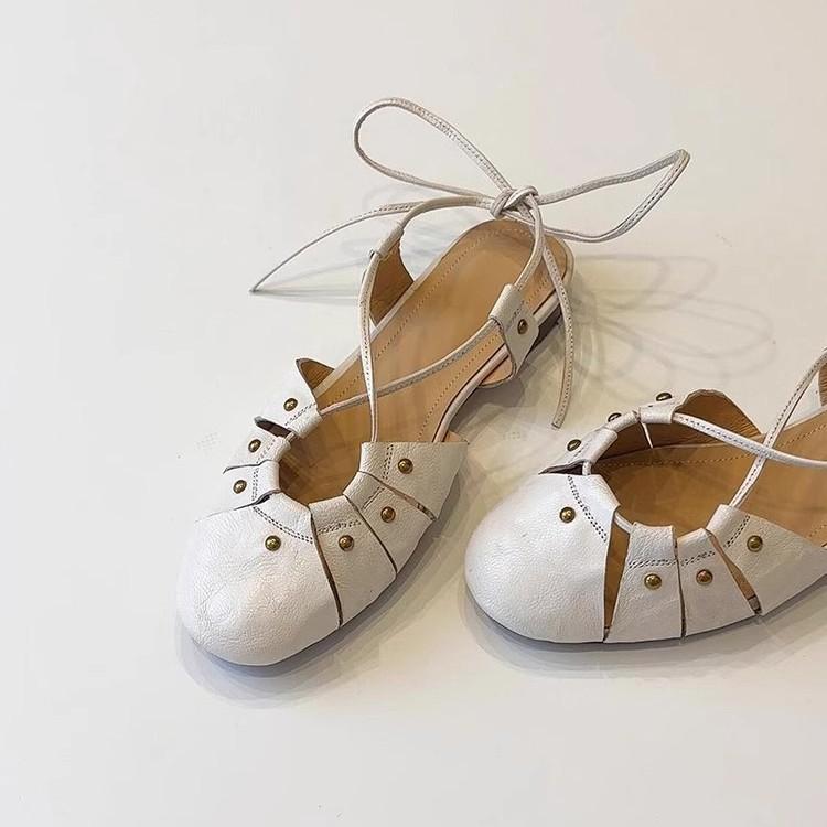 Niche version~ summer new rivet hollow cross strap bag head shoes women's retro shallow mouth low heel soft leather sandals