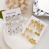 Goldfarbene Seestern-Muschel-Kombination Steckerohrringe Set für Damen Metall Muscheln Muschel Schleifenknoten Ohrring Boho Party Schmuck