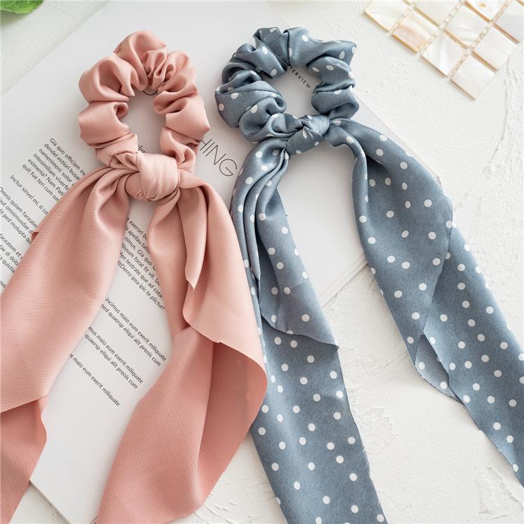 Long flowing ribbon large braided hair accessory for women - ponytail bun hair band with floral design, simple and elegant.