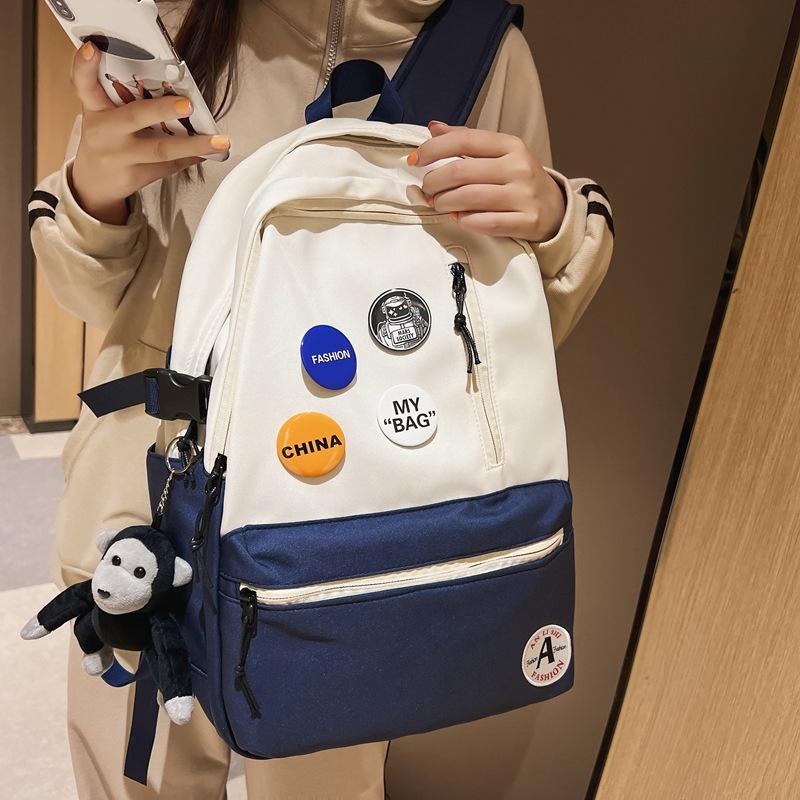 

Student schoolbag new vertical zipper badge large capacity junior high school backpack with pendant