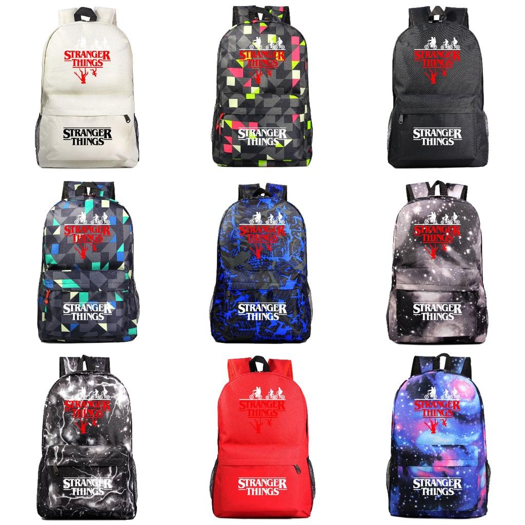 A102 Stranger Things Oxford-Stoffrucksack in Bonbonfarben, wasserdicht und strapazierfähig, ideal für Teenager und Reisende, mit Charaktermotiven)