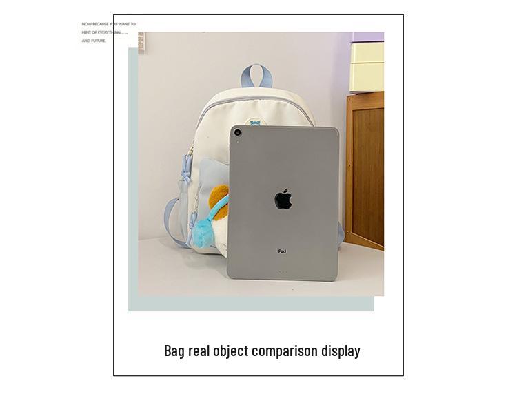 Cute Cartoon Trendy Backpack: Large Capacity, Lightweight, Versatile Travel/School Bag with Earphone and Doll Holder.