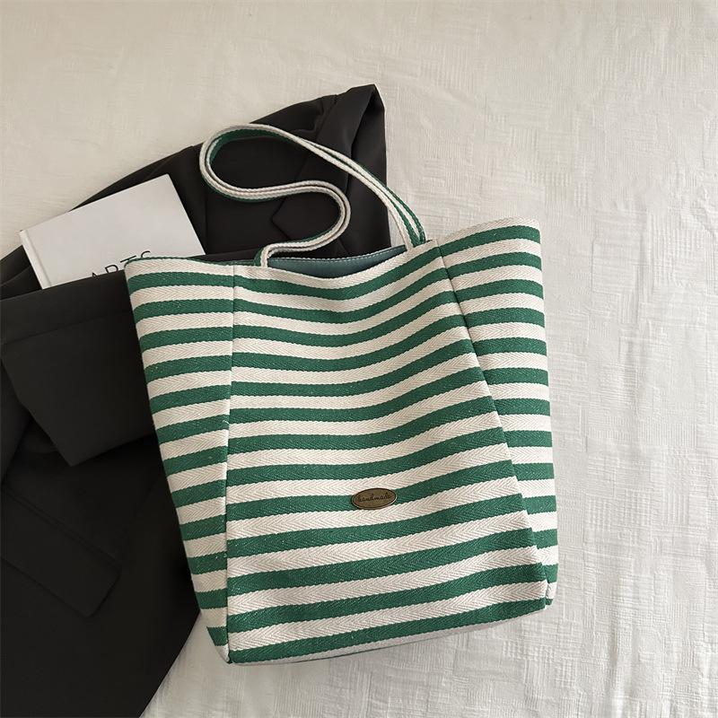 

Полосатая тканевая двусторонняя доступная сумка 2025 новая сумка-тоут в стиле ленивый ветер повседневная на плечо большая вместимость сумка-тоут зелёный