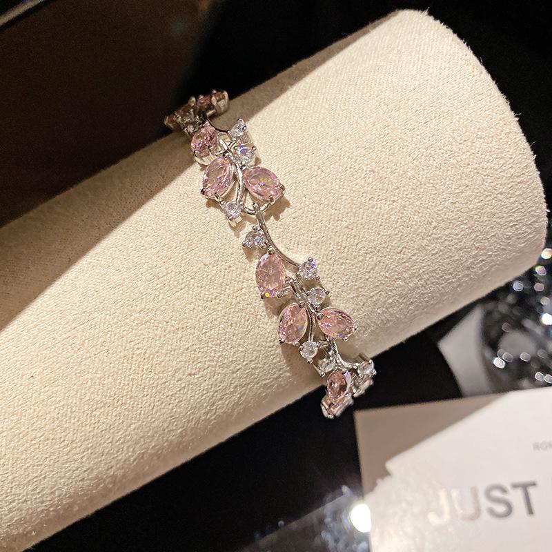 Pink Diamond Zirconia Starburst Flower Bracelet: Trendy, Luxurious Jewelry with Unique Design.