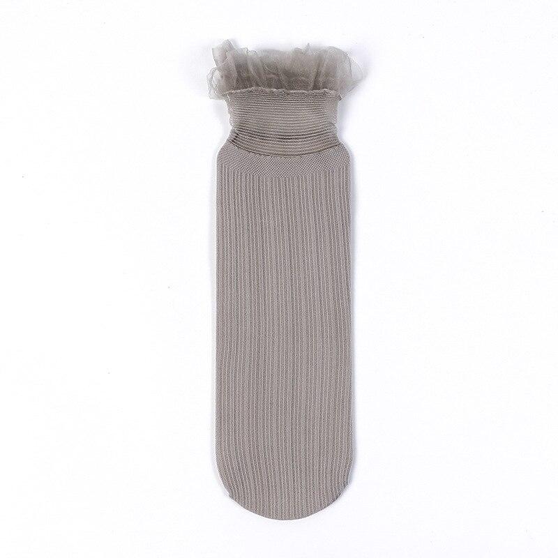 1 paire de chaussettes tendance pour femme, couleur unie, douces et mignonnes, en maille fine