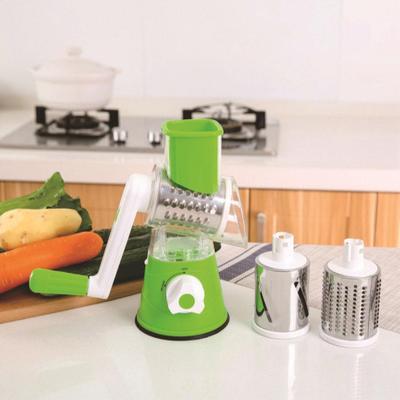 Cortador de vegetais vertical multifuncional com três cabeças de faca intercambiáveis para uso internacional na cozinha.