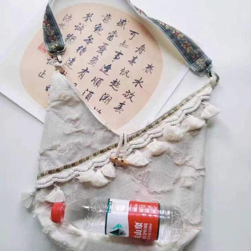 Autumn new retro literary and artistic vacation wind ear tassel daily light cloth bag versatile large capacity shoulder messenger bag