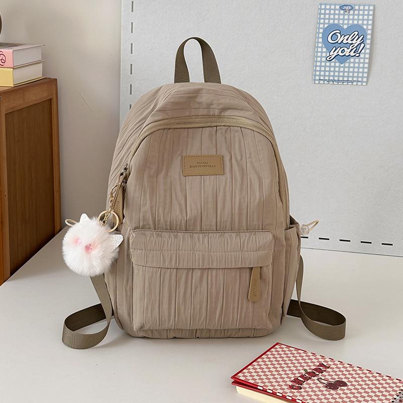 School bag junior high school girls large capacity solid color light primary school backpack high value girl versatile backpack