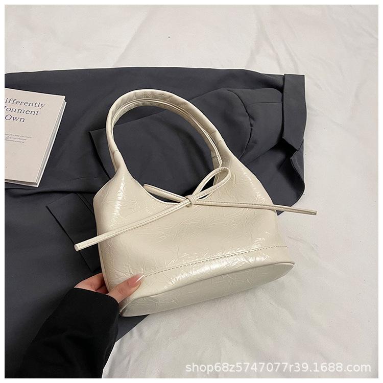 Bow niche portable bucket bag women's 2025 new trendy fashion simple commuter casual shoulder bag