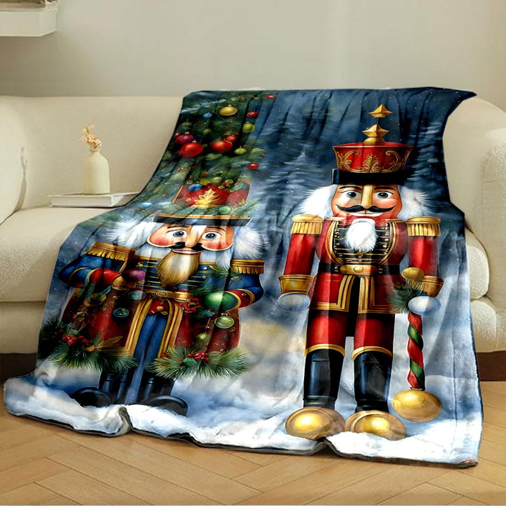 Two Festive Nutcracker Figures, One In Red and One In Blue, In Snowy Scenery. for All Seasons Blanket Lunch Break Throw Gift
