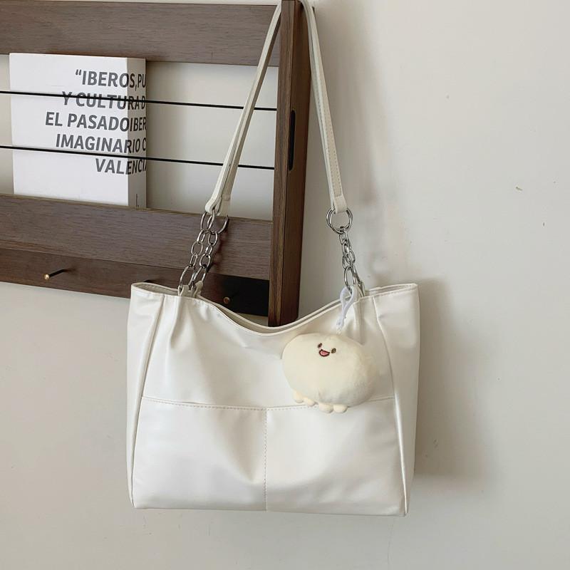 

Chic And Spacious Black And Cream Pu Tote Bag For Women With Single Shoulder Strap And Stylish Design Without Pendant вершковий