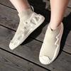 Calzini e scarpe traspiranti alla moda Scarpe sportive in tessuto a mosca tinta unita Scarpe per il tempo libero all'aperto da uomo e da donna Scarpe da tavolo 36-47