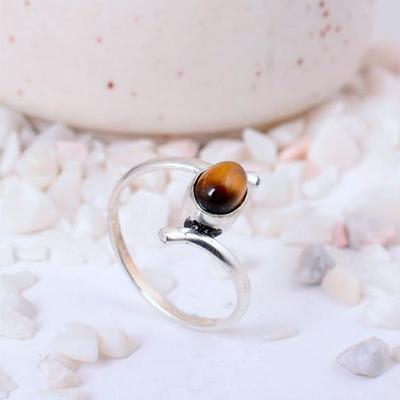 Handcrafted Silver-Toned Ring with an Oval Tiger's Eye Gemstone and Unique Bypass Band Design