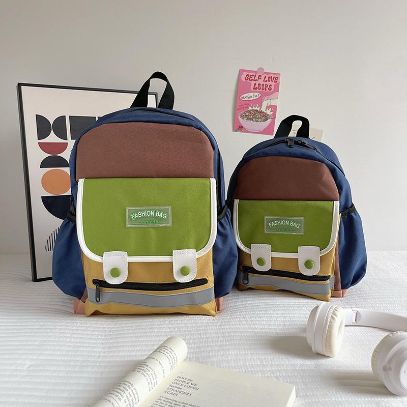 

Children s backpack ultra-light fashion contrasting colors Elementary school backpack Boys and girls Kindergarten baby schoolbag fashion Small коричневий
