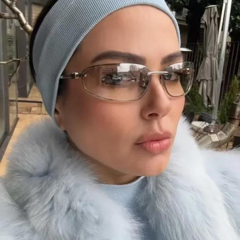 Summer New Elliptical Frameless Women's Sunglasses Retro Super Light Neutral Advanced Show Temperament Sunscreen Sunglasses