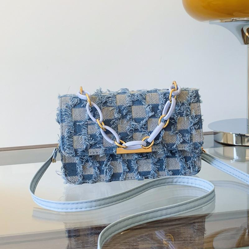 Fashionable Medium-sized Canvas Handbag With Unique Stitching And Tassel Features