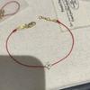 Handgewebtes rotes Schnurarmband mit vergoldetem vierblättrigem Klee-Anhänger für Damen, Paare, Luxuriöser minimalistischer Stil